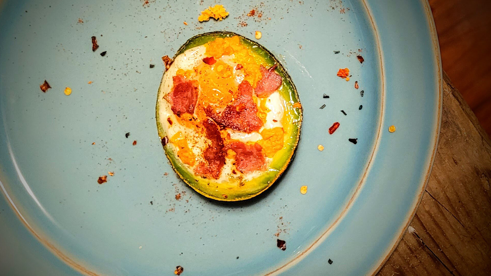 Baked egg avocado stuffed with goat cheese