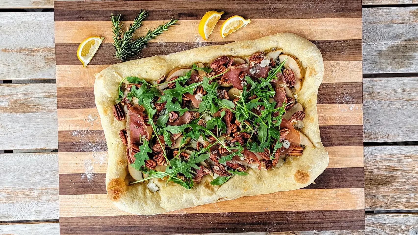 Blue cheese pear prosciutto flatbread rosemary vinaigrette